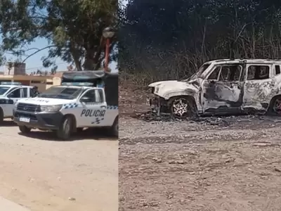 foto ilustrativa m�vil policial y auto incendiado